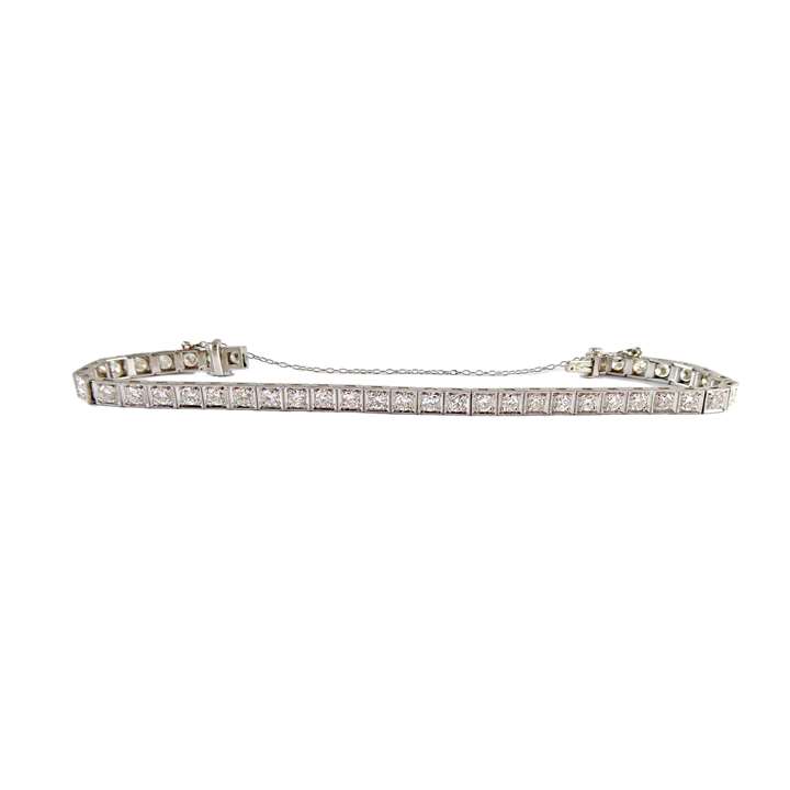 Art Deco diamond line bracelet with box collets, c.1920, with 41 uniform round brilliant cut diamonds,